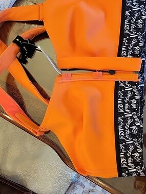 SHEFIT Orange Active Sports Bra with White Motivational Text